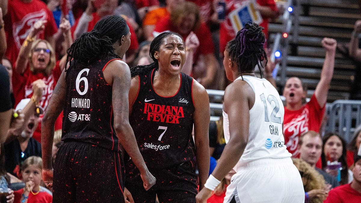Indiana Fever forward Aliyah Boston celebrating after scoring during a basketball game.