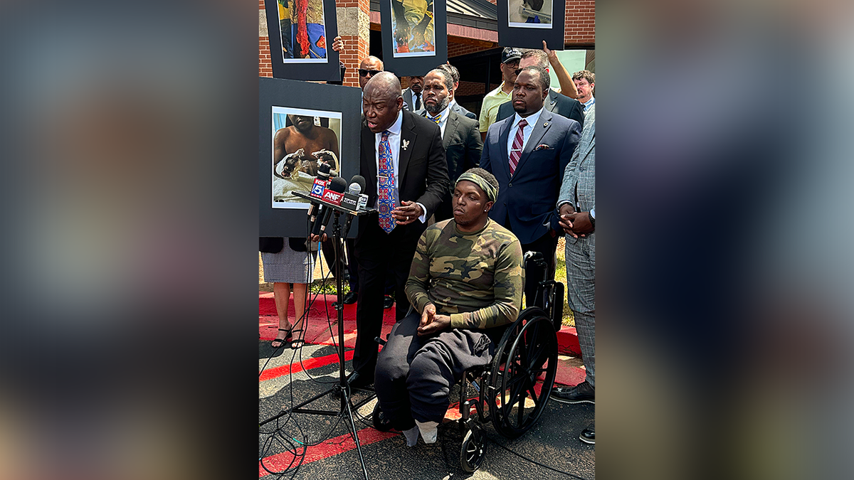 Attorney Ben Crump and his client, Rashaad Muhammad