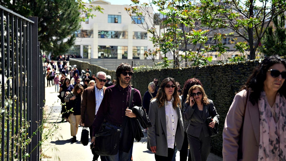 People leaving a courthouse after a gunman opened fire in Athens