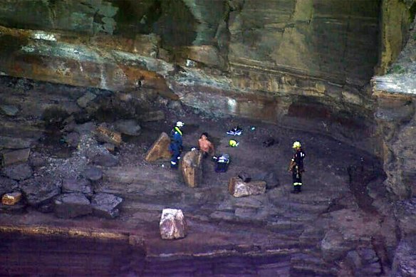 Rescuers abseiled down the jagged cliff to the 18-year-old.