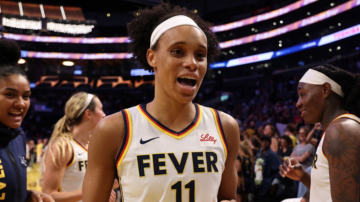 Indiana Fever forward Brianna Turner celebrating on the basketball court.