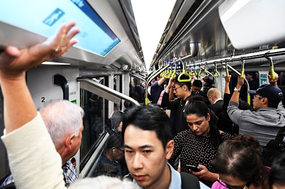 Commuters pack a CBD-bound metro train during the morning peak.