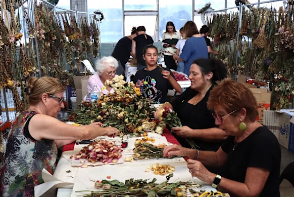 More than 100 volunteers are busy at work preserving items left at the memorial at Bondi Pavilion.