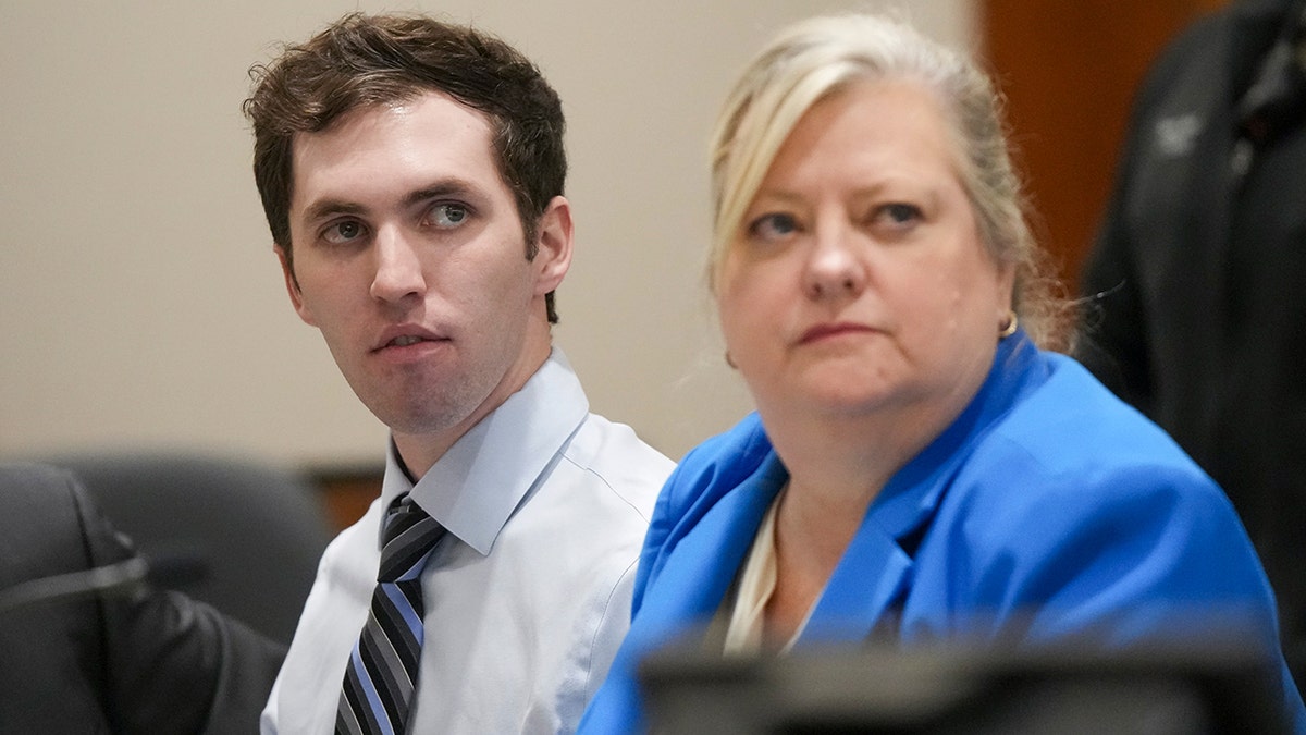 Tyler Robinson sitting beside defense attorney Kathryn Nester in court