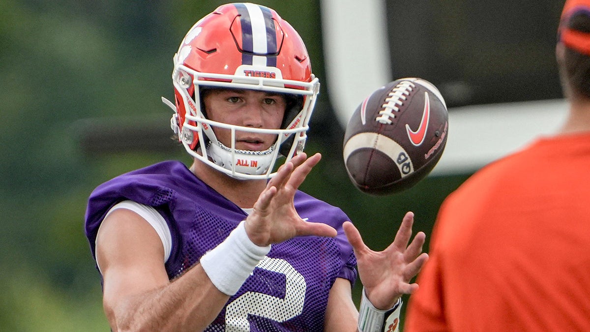 Clemson quarterback Cade Klubnik throwing a football during practice