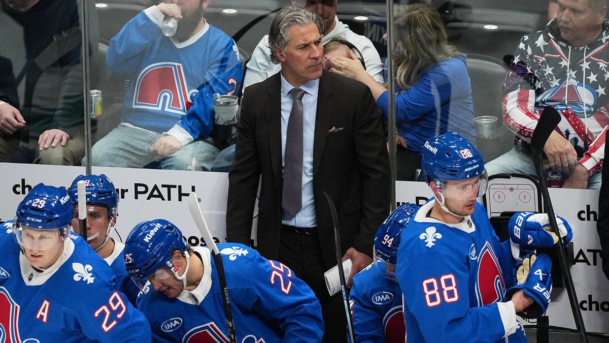 Colorado Avalanche head coach Jared Bednar watching from team box during NHL game