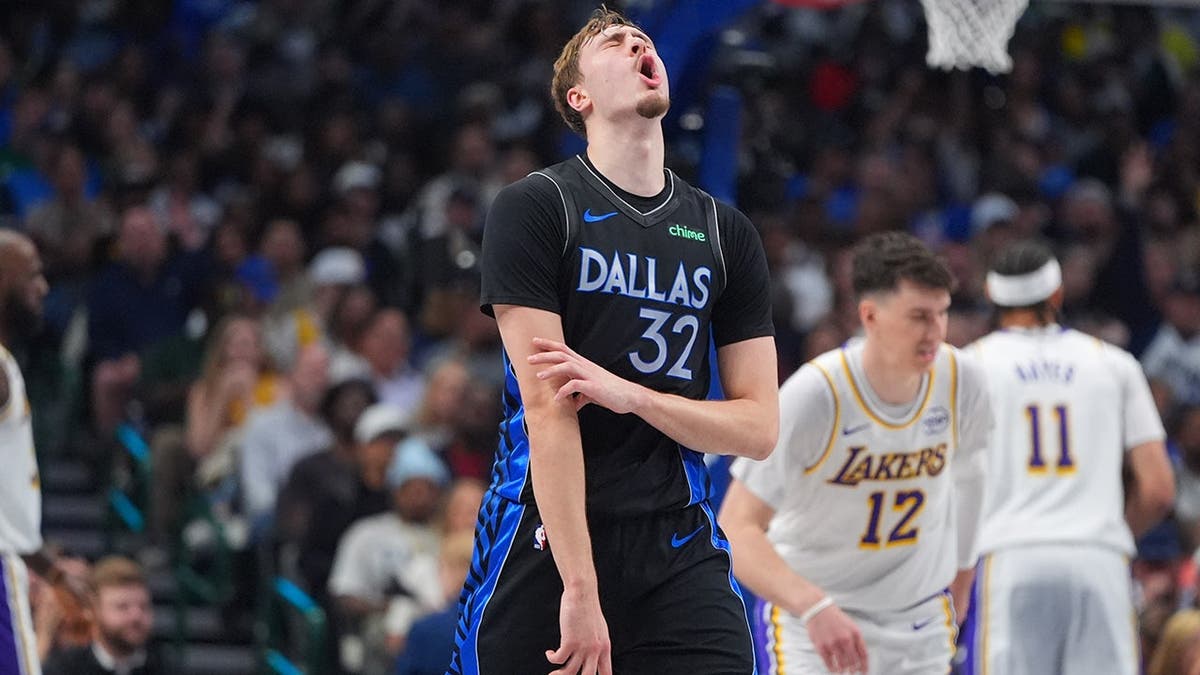 Dallas Mavericks forward Cooper Flagg reacting during a basketball game