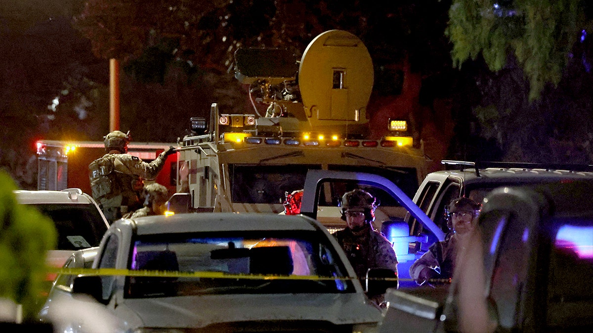 Louise Barnsley standing in front of a home with security measures