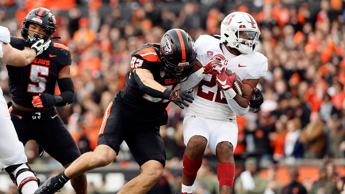 Oregon State Beavers linebacker Cory Stover sacks Stanford Cardinal running back E.J. Smith at Reser Stadium