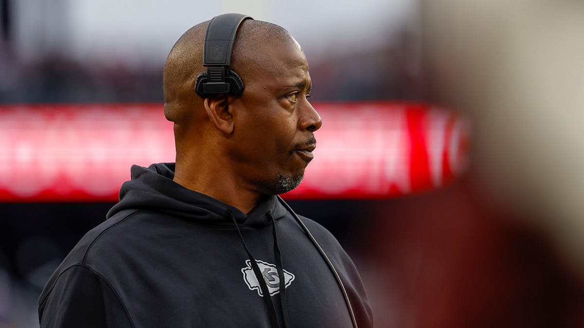 Kansas City Chiefs defensive backs coach Dave Merritt standing on the sideline during a football game