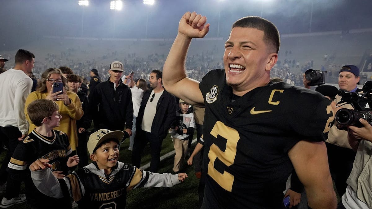 Vanderbilt quarterback Diego Pavia celebrating on the field