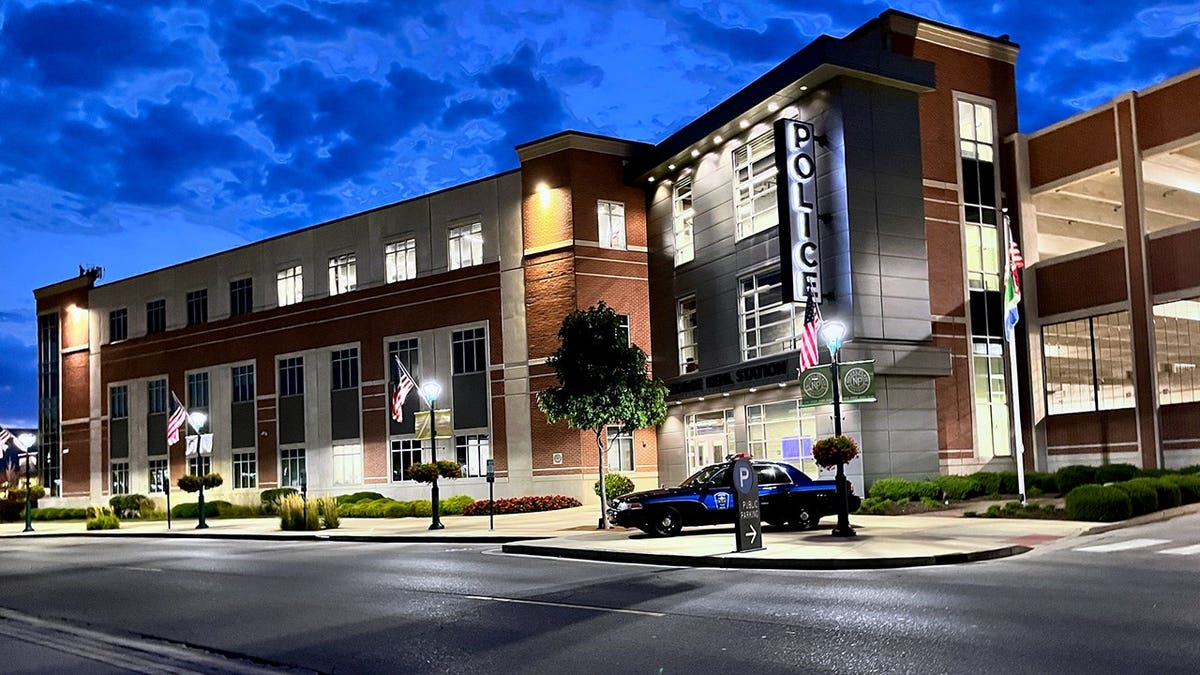 a police car outside police headquarters