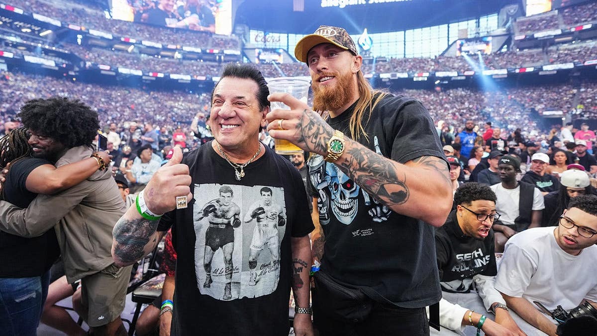 George Kittle and Chuck Zito standing at Allegiant Stadium in Las Vegas
