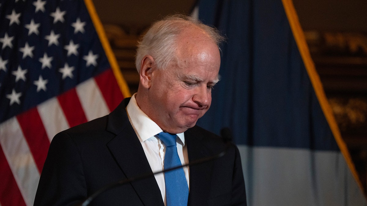 Minnesota Governor Tim Walz speaking at a press conference at the State Capitol in St. Paul