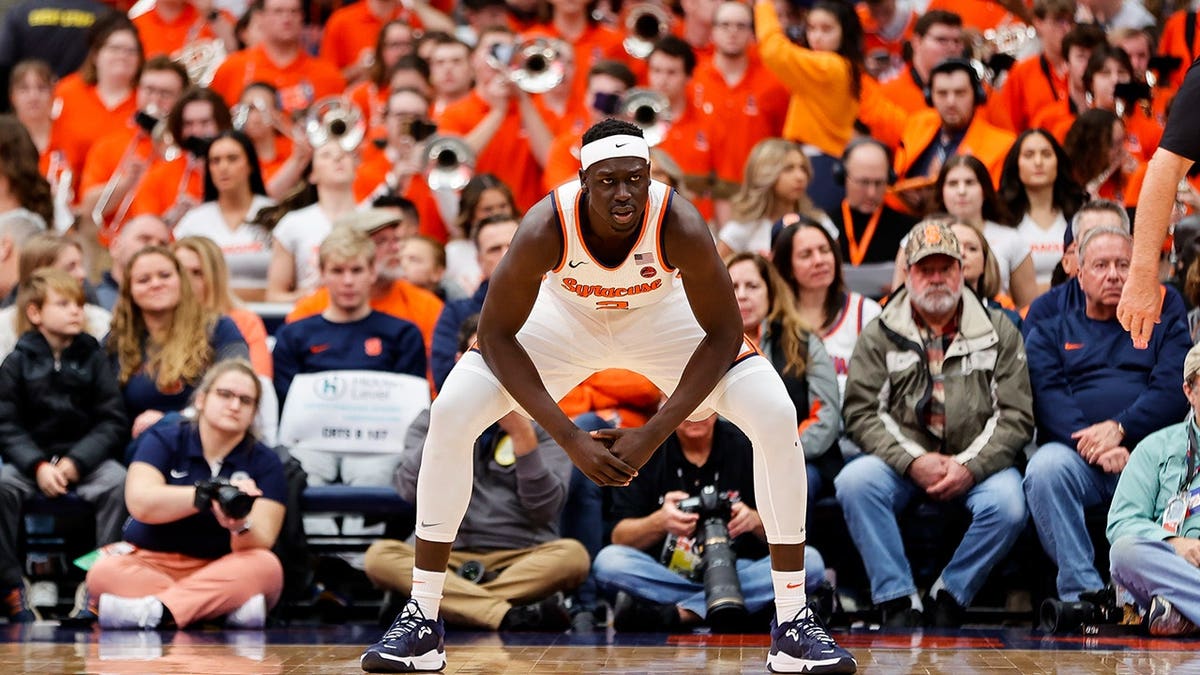 John Bol Ajak wearing Syracuse Orange uniform preparing to play basketball at JMA Wireless Dome