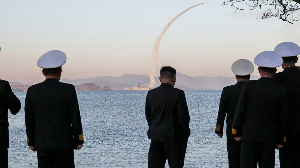 North Korean leader Kim Jong Un observing missile test from destroyer Choe Hyon