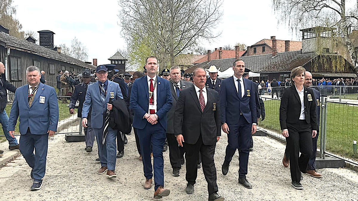 International group of law enforcement members visit Auschwitz.