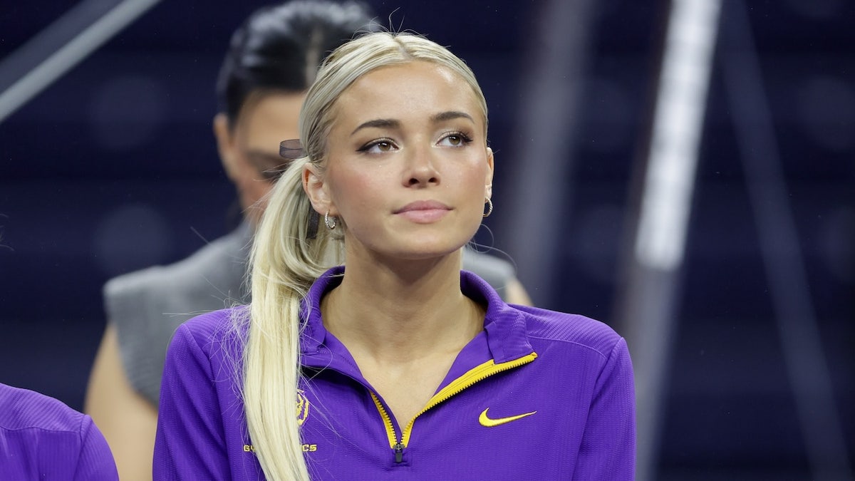 Olivia Dunne standing in LSU Tigers uniform at Neville Arena