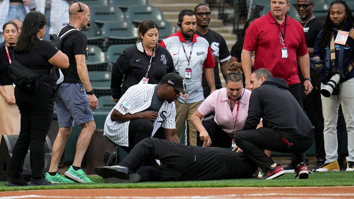 A man collapses while singing before a baseball game in Chicago