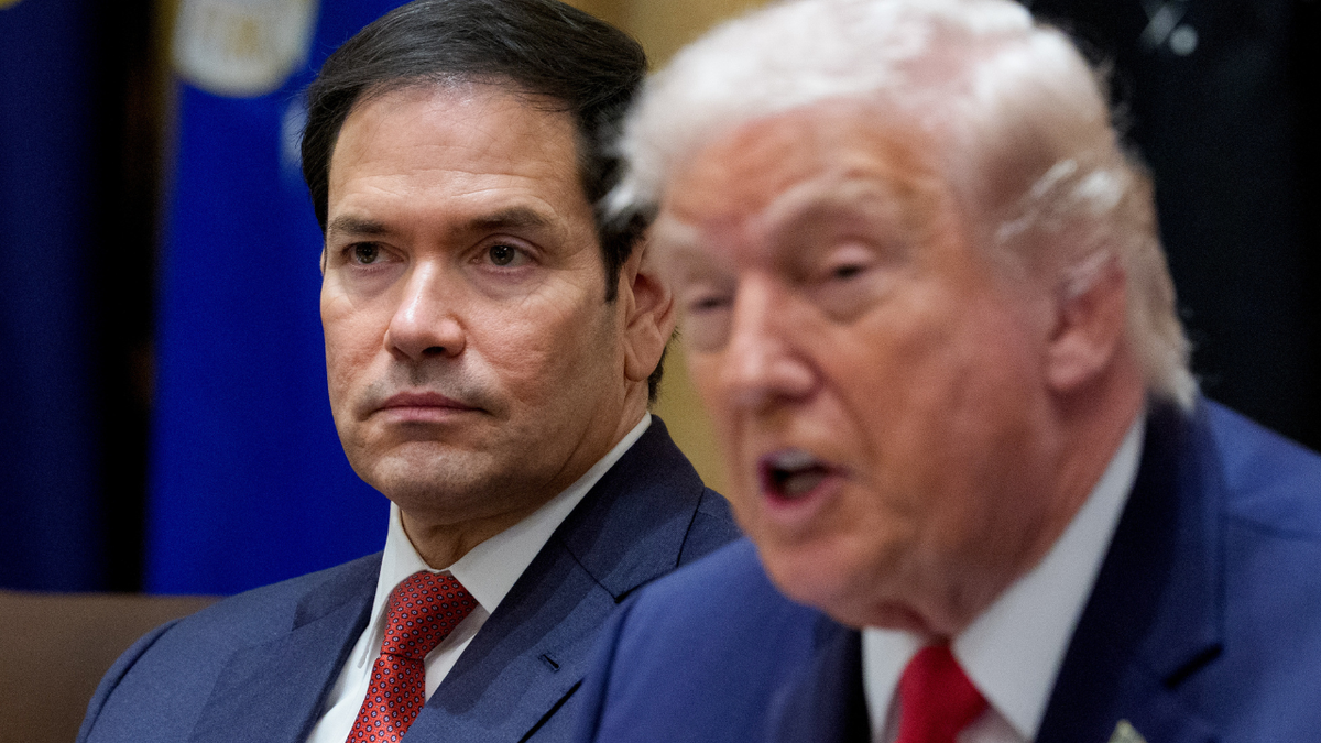 U.S. Secretary of State Marco Rubio sitting next to President Donald Trump during a cabinet meeting at the White House.