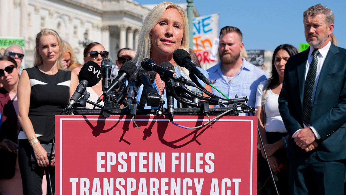 Rep. Marjorie Taylor Greene speaking at a news conference outside the U.S. Capitol with alleged victims of Jeffrey Epstein