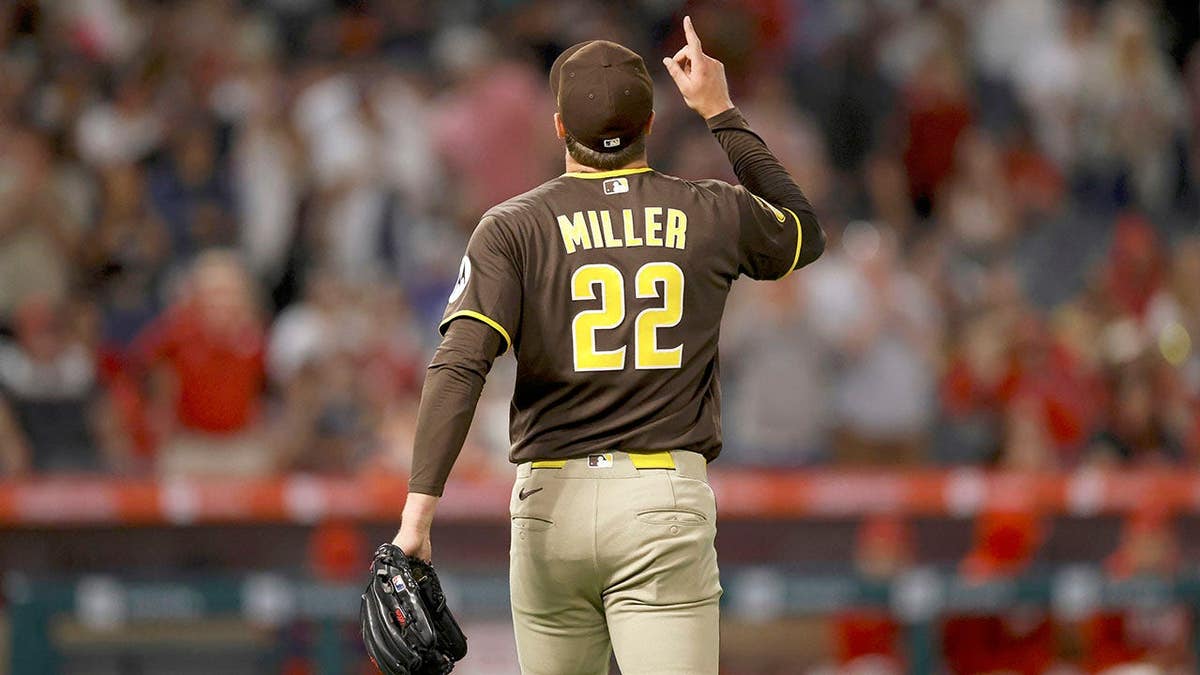 San Diego Padres relief pitcher Mason Miller celebrating on the field