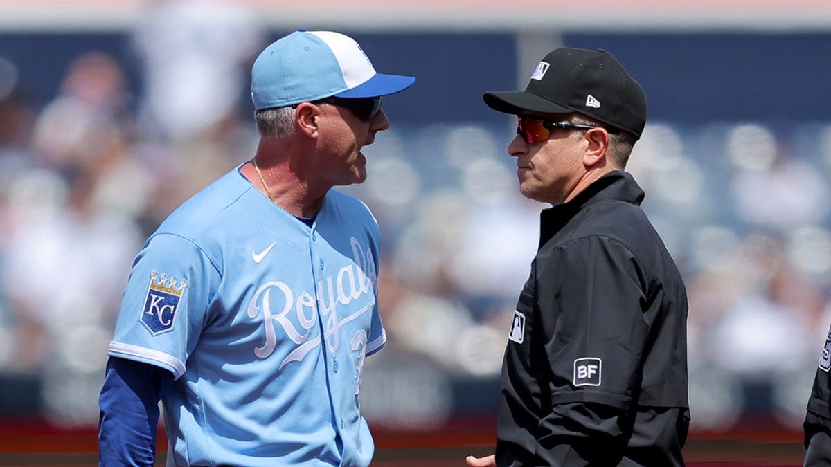Kansas City Royals manager Matt Quatraro arguing with umpires at Yankee Stadium