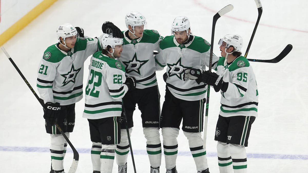 Dallas Stars center Mavrik Bourque celebrating with teammates on ice at PPG Paints Arena