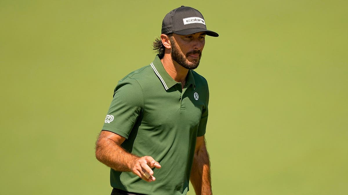 Max Homa waving after his putt on the second hole at Augusta National Golf Club