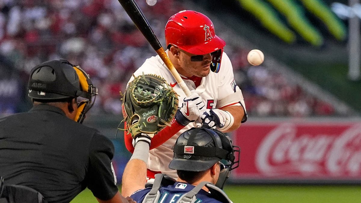 Los Angeles Angels' Mike Trout hit by pitch during baseball game in Anaheim