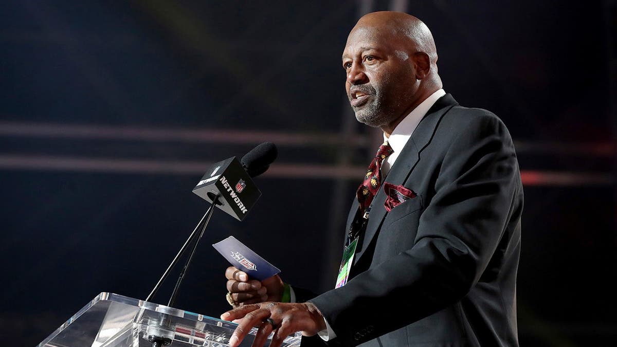 NFL legend Monte Coleman announces a selection during the NFL draft