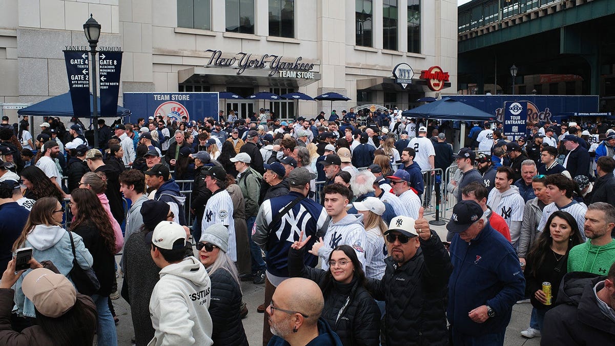 New York Yankees fans waiting in line outside Yankee Stadium.