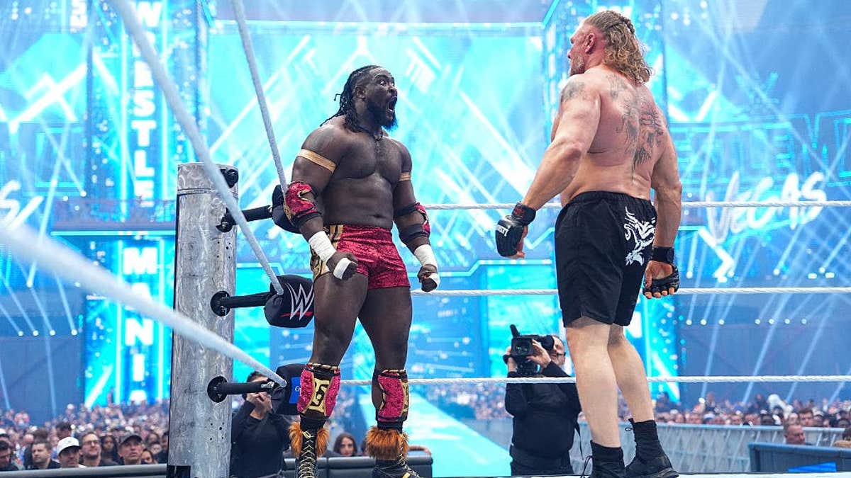 Oba Femi and Brock Lesnar face off in a wrestling ring at Allegiant Stadium