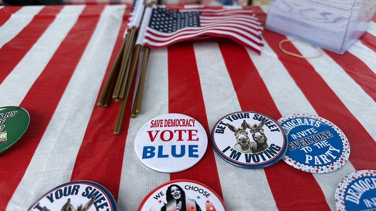 A table with political flags and buttons outside a polling site in north Raleigh, N.C.