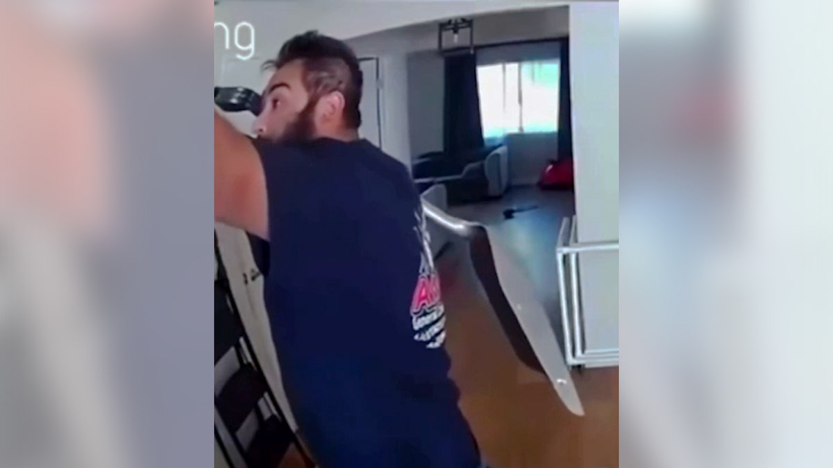 Man holds a shovel in house