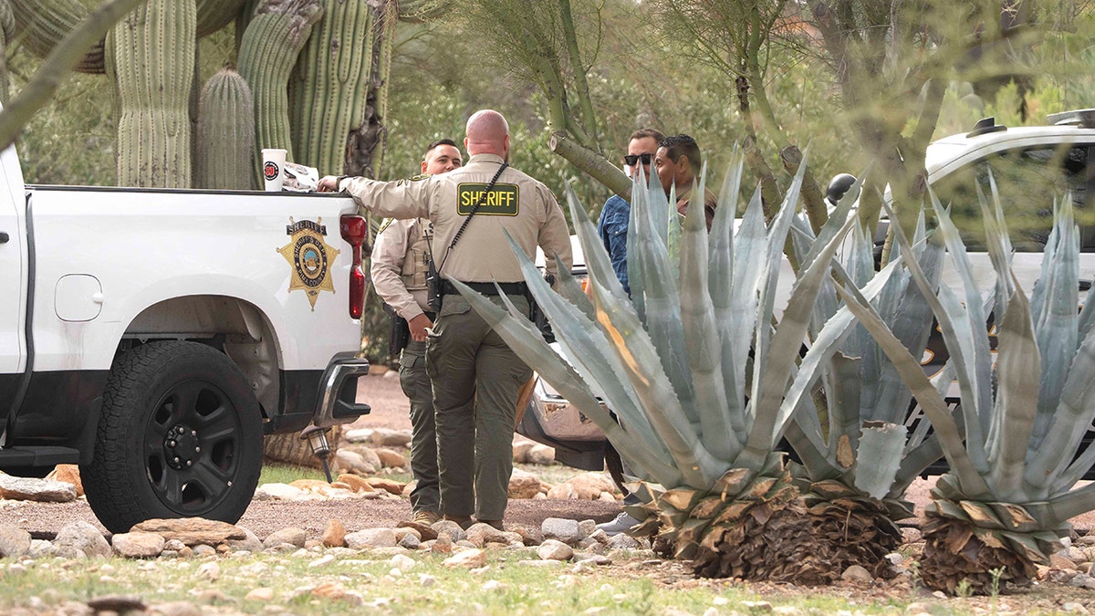 Pima County Sheriff’s deputies standing outside Nancy Guthrie's home in Tucson, Arizona