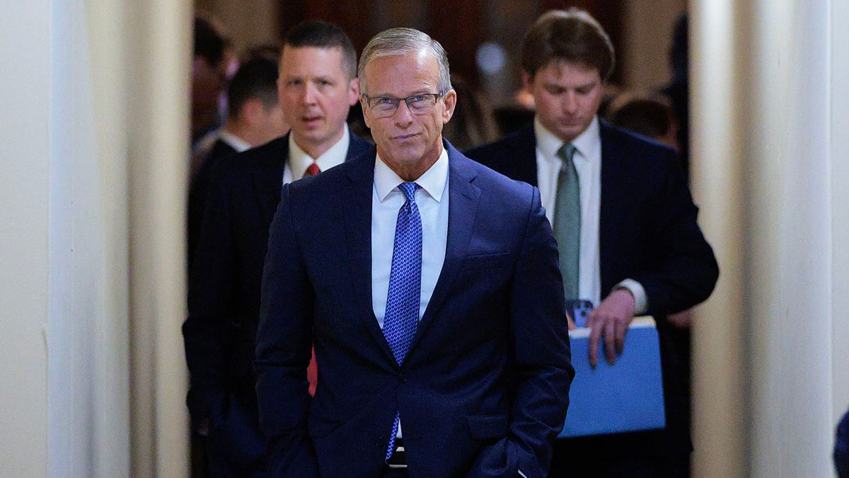 Senate Majority Leader John Thune walking in the U.S. Capitol hallway
