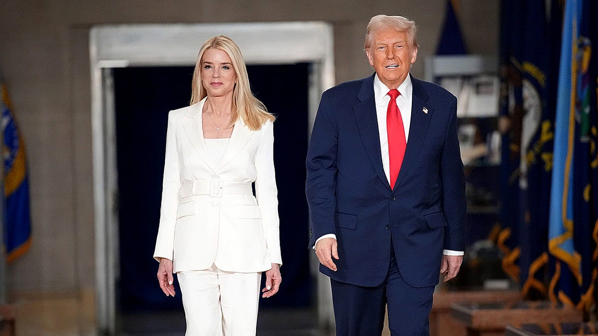 President Donald Trump walking with U.S. Attorney General Pam Bondi at the Justice Department
