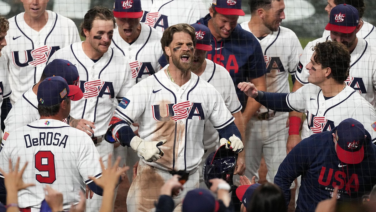 Bryce Harper celebrating after hitting a two-run home run during a baseball game.