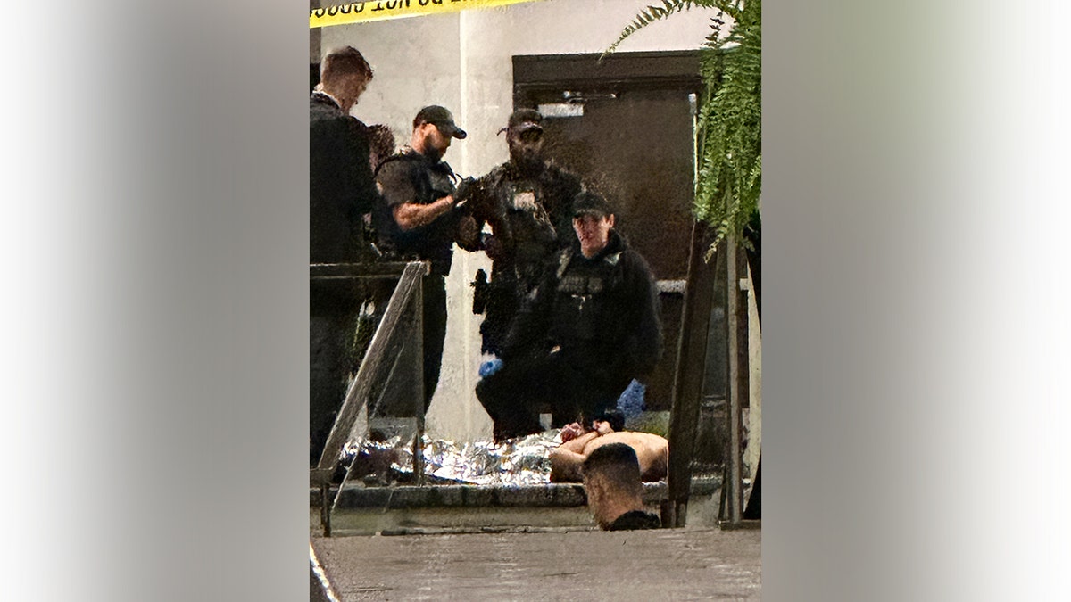 Cole Tomas Allen being restrained by law enforcement officers at the White House Correspondents Dinner