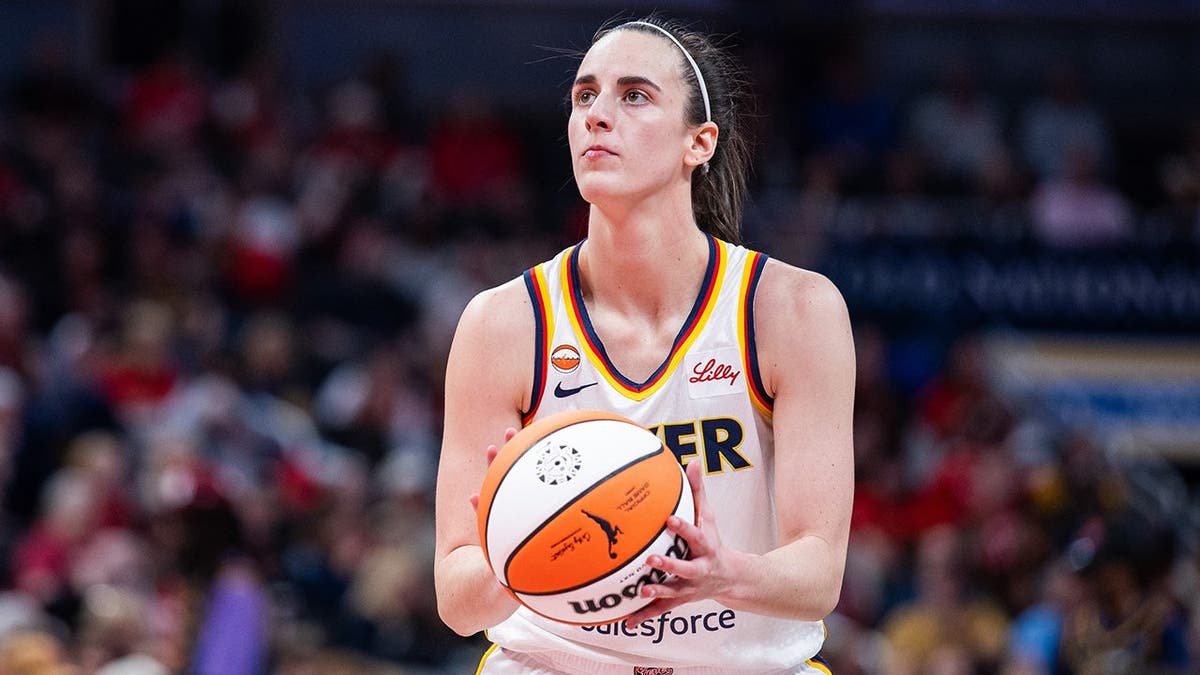 Indiana Fever guard Caitlin Clark shooting a basketball during a game at Gainbridge Fieldhouse