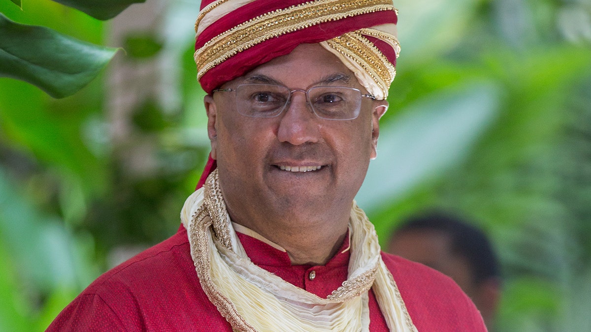 Neville Roy Singham smiling at his wedding to Jodie Evans in Ocho Rios Jamaica