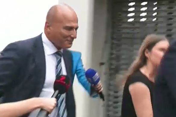Surgeon Reza Adib arrives at Southport Police Station, a day after his home was raided by police.