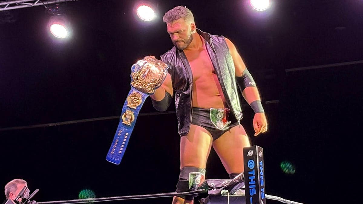 Zack Clayton holds the belt