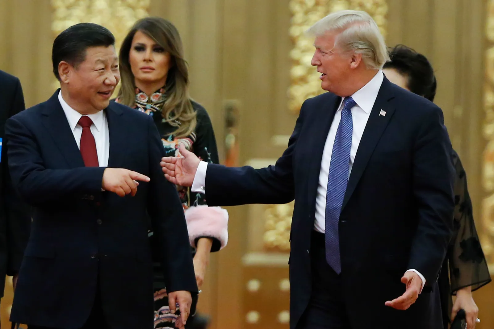 U.S. President Donald Trump and Chinese President Xi Jinping arrive for a state dinner with the first ladies at the Great Hall of the People in Beijing on November 9, 2017. (Thomas Peter/Pool Photo via AP)