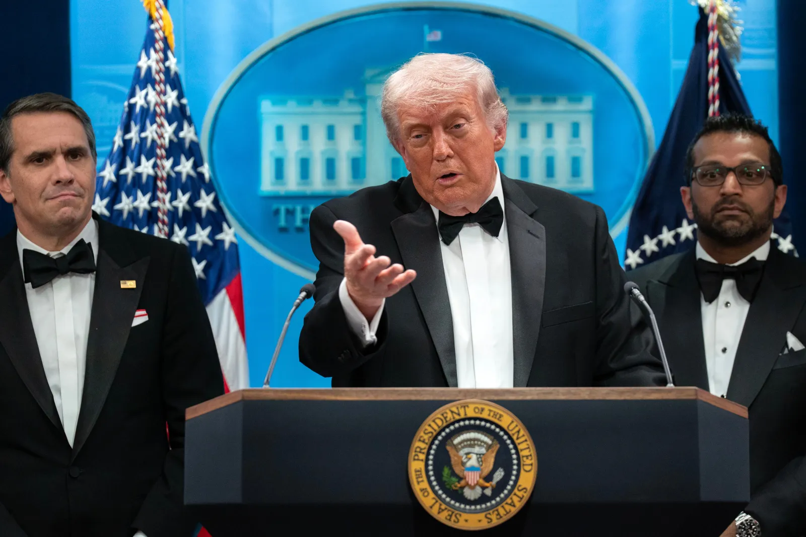 President Donald Trump speaks in the James Brady Press Briefing Room at the White House after a shooting incident outside the ballroom at the annual White House Correspondents' Association dinner in Washington, on April 25 as acting Attorney General Todd Blanche and FBI director Kash Patel listen. (AP Photo/Jose Luis Magana)