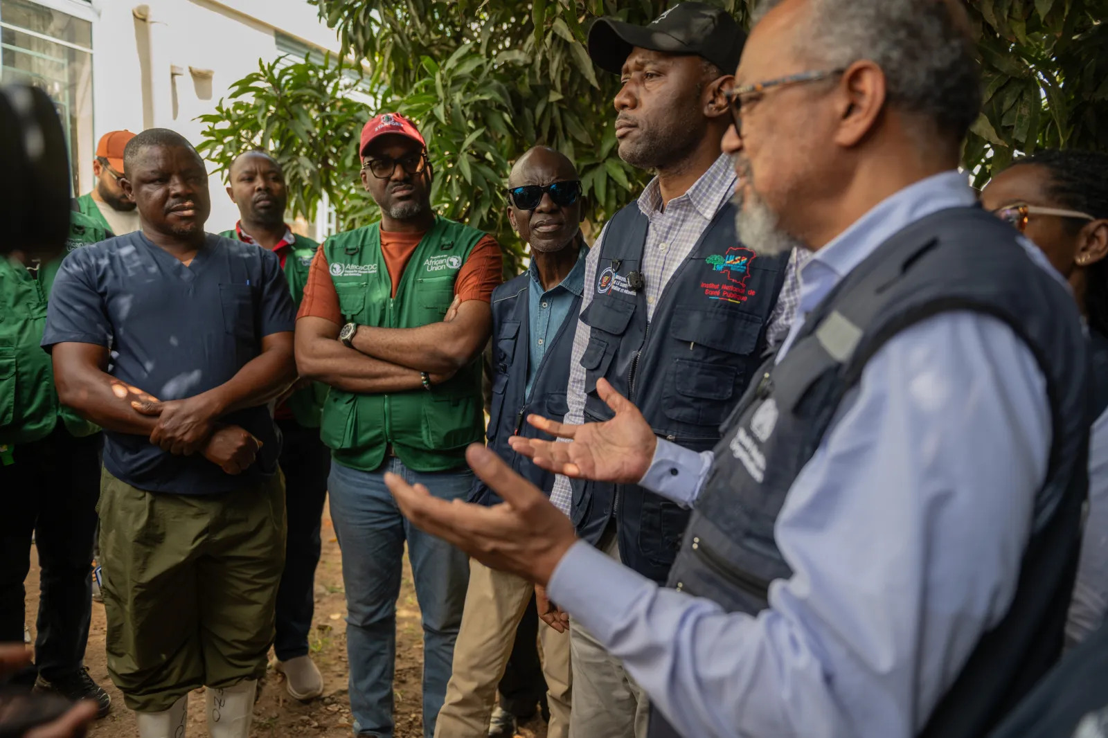 Director General of the World Health Organization (WHO), Tedros Adhanom Ghebreyesus, meets with health workers who recovered from Ebola in Bunia, Congo, on May 31. (AP Photo/Moses Sawasawa)