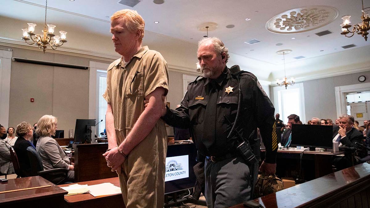 Alex Murdaugh wearing a tan jumpsuit and handcuffs at sentencing