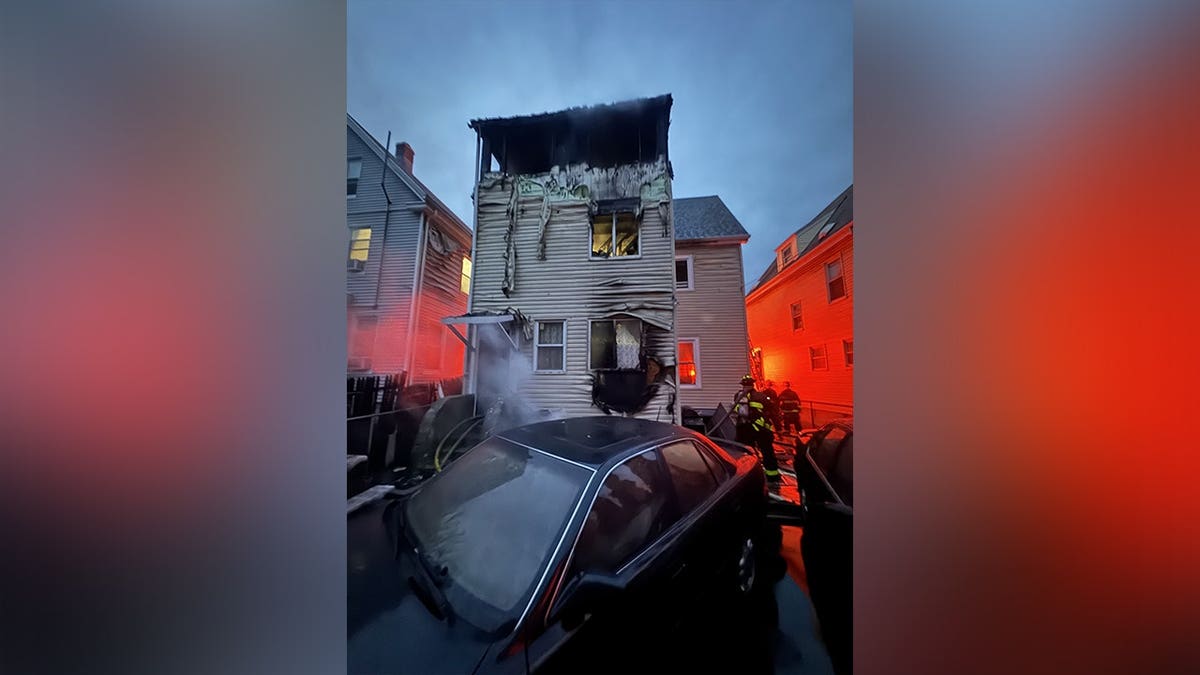 A heavily damaged home after a fatal three-alarm fire in Dorchester