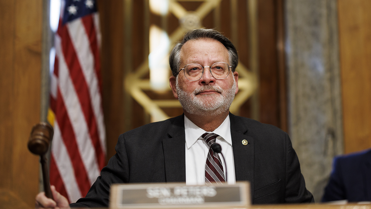 Sen. Gary Peters, a Democrat from Michigan, gavels in during a hearing in Washington, D.C., on Nov. 17, 2022.